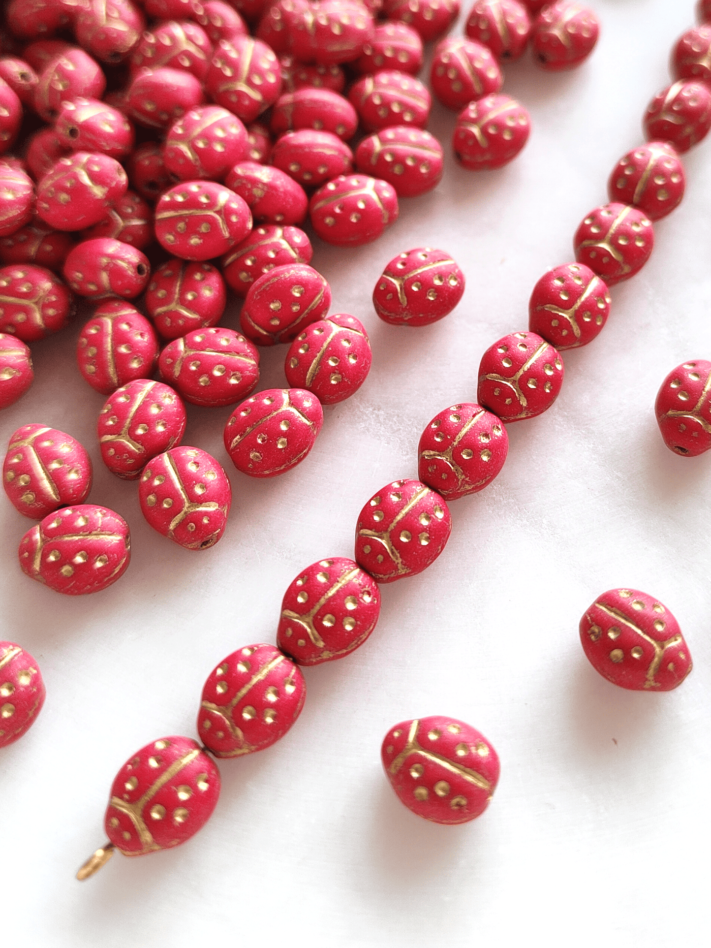 Lady bug beads 10x7mm - matt red & gold