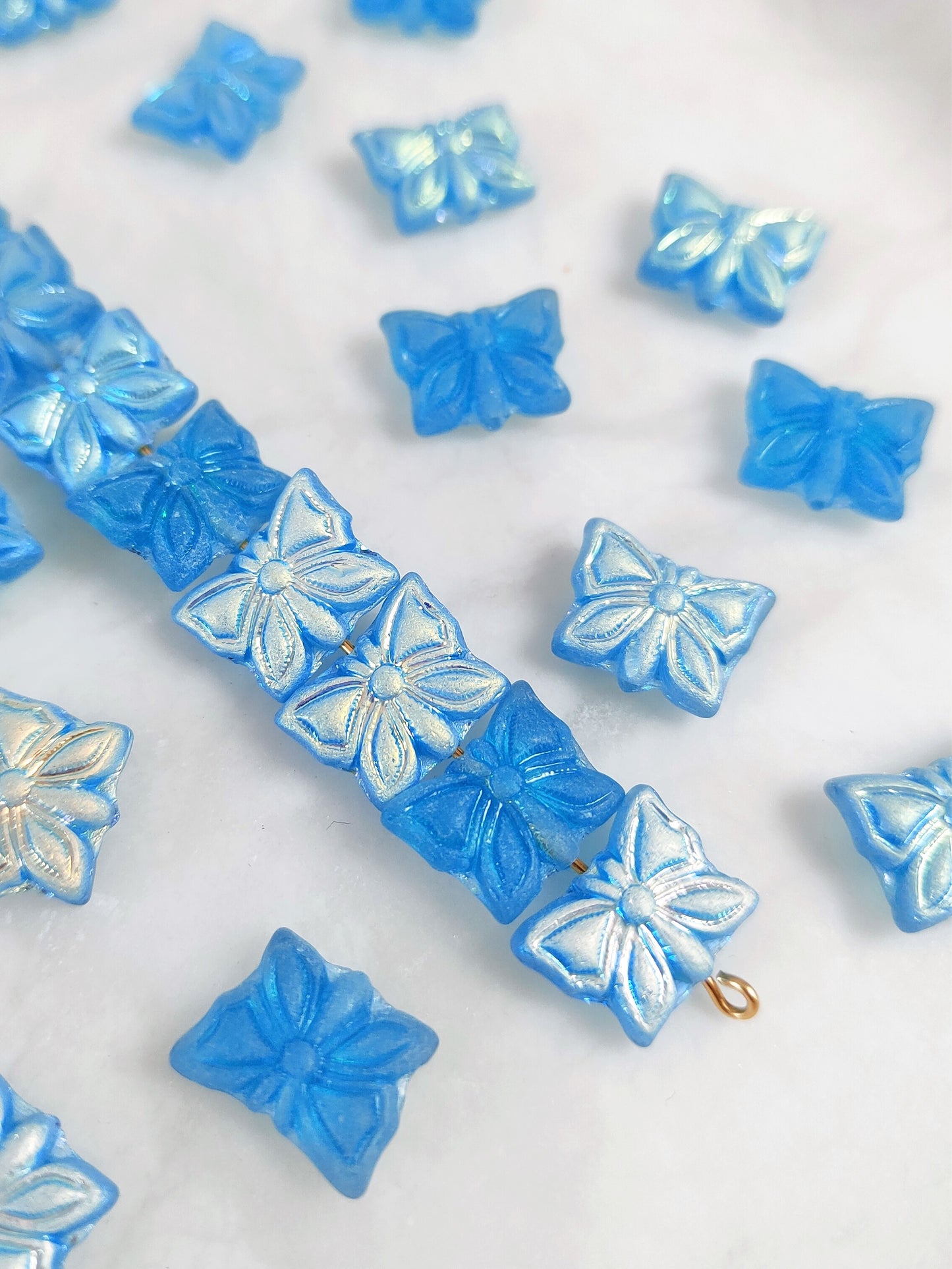 Butterfly beads 15x12mm - Caribbean blue iris