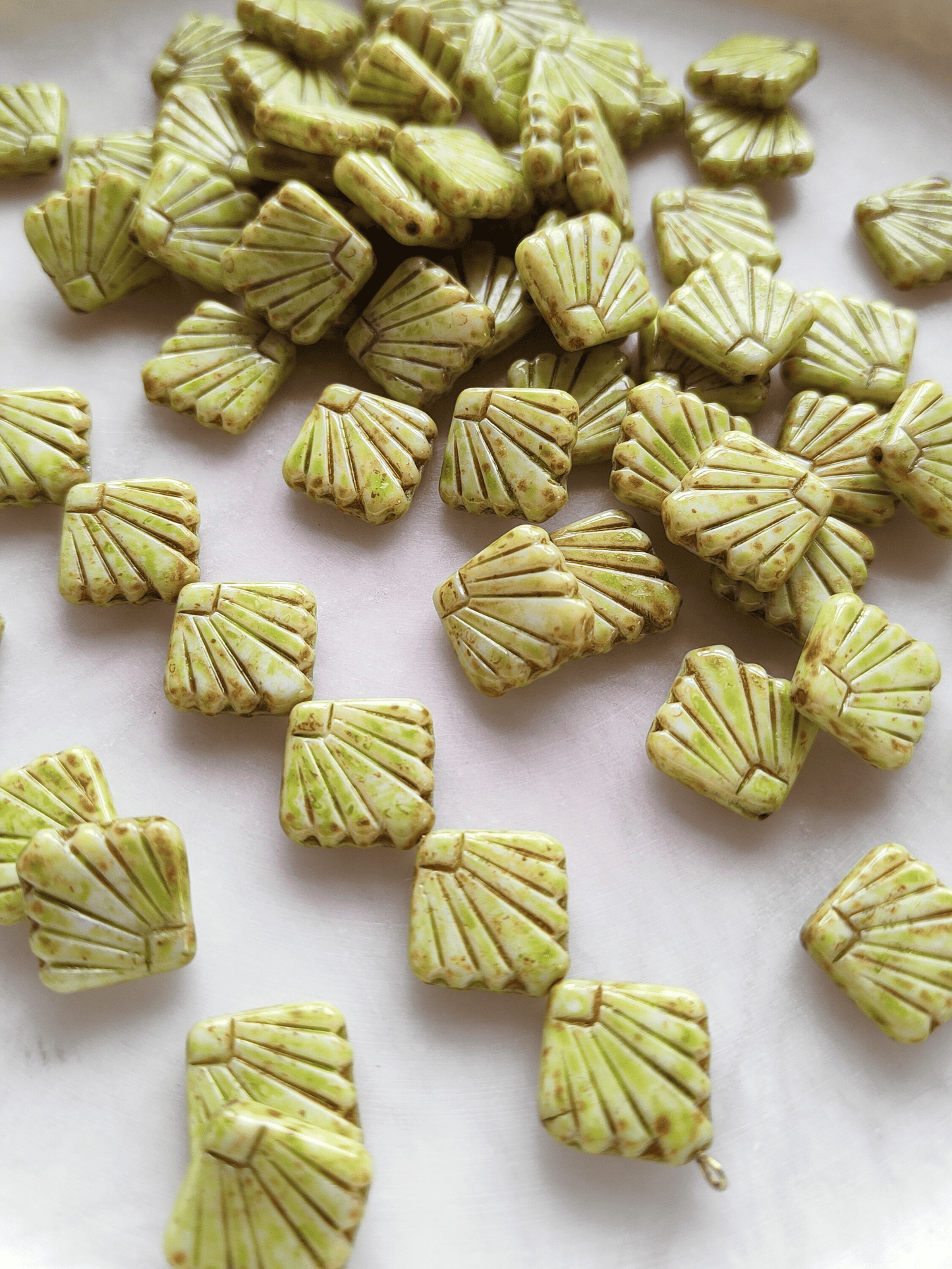 Fan ornament beads 17mm - light green & brown speckled