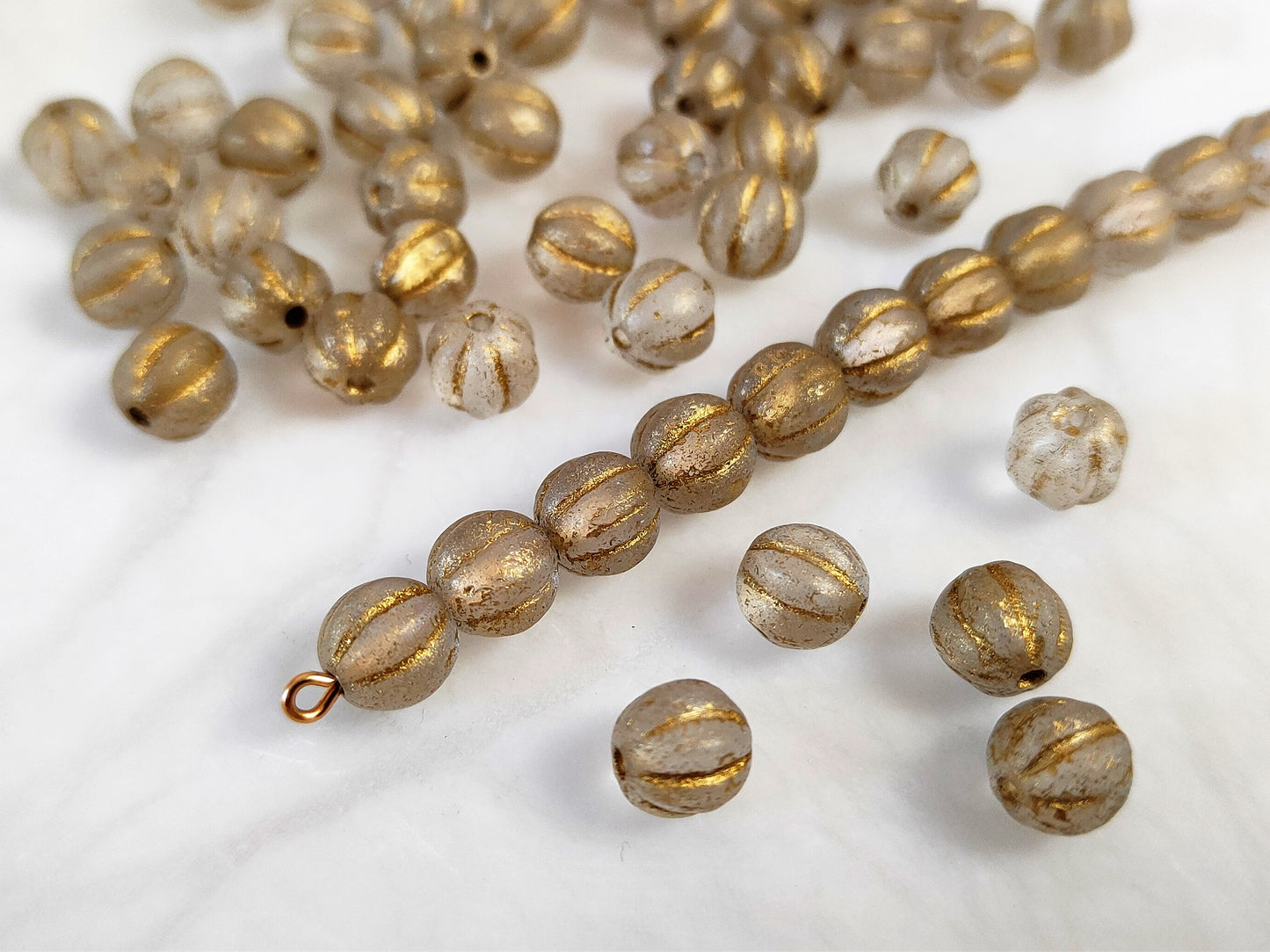 Melonen 8mm - bereift Gold