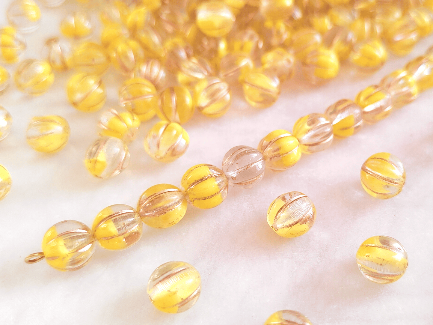 Melon beads 8mm - colorless, yellow & copper
