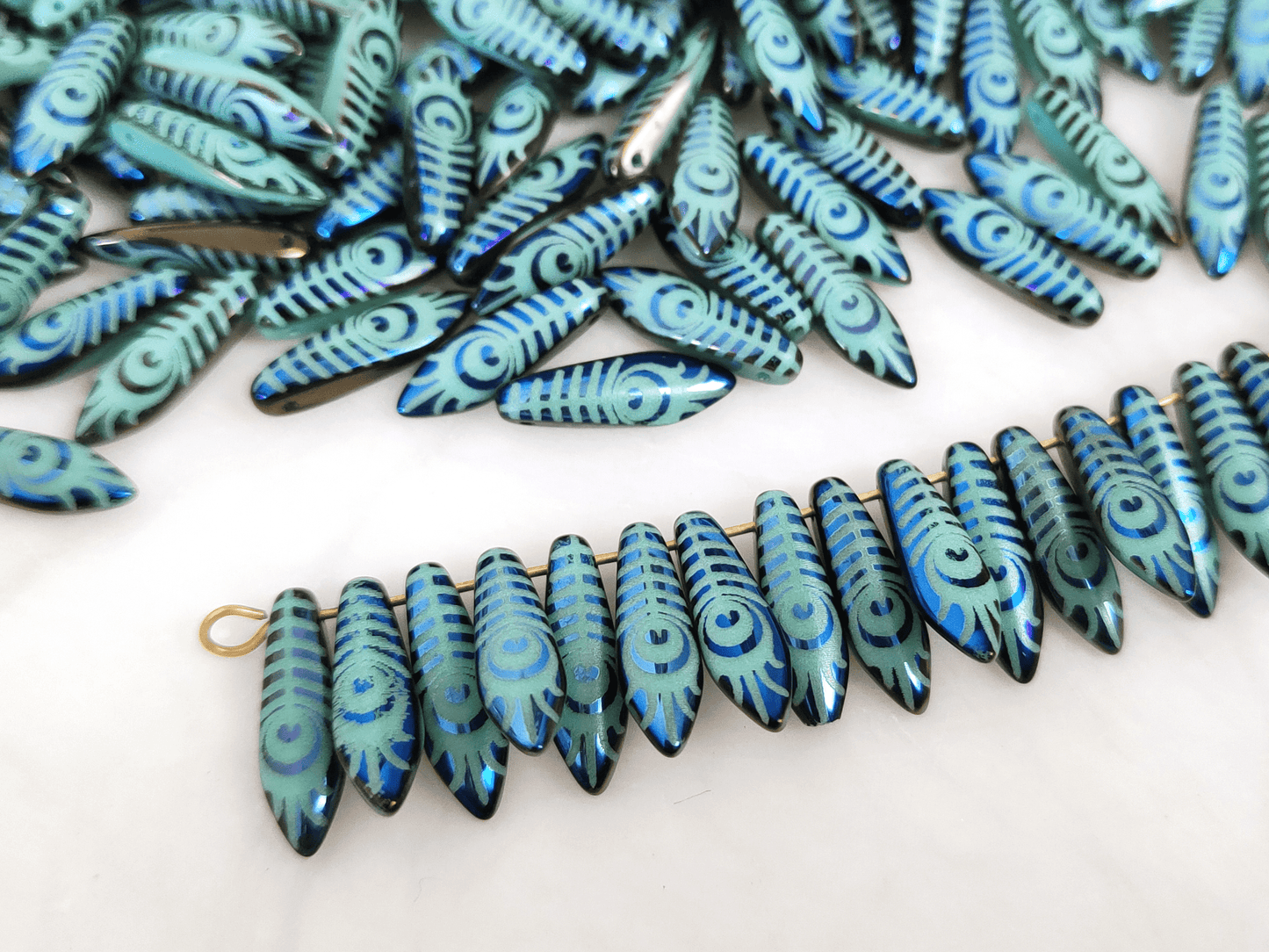 Dagger beads 5x16mm - turquoise, dark blue & feather motif