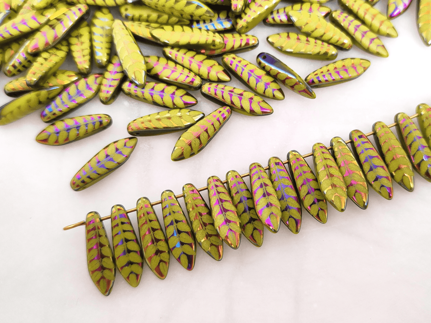 Dagger beads 5x16mm - light green & leaf motif