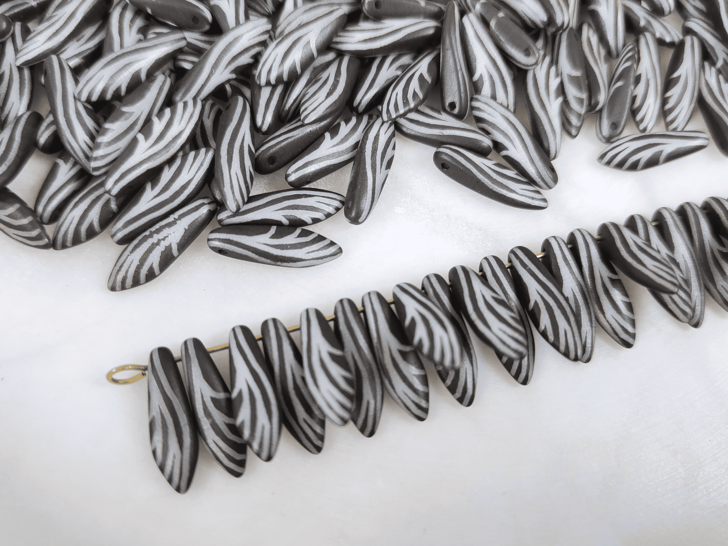 Dagger beads 5x16mm - black & insect wing motif