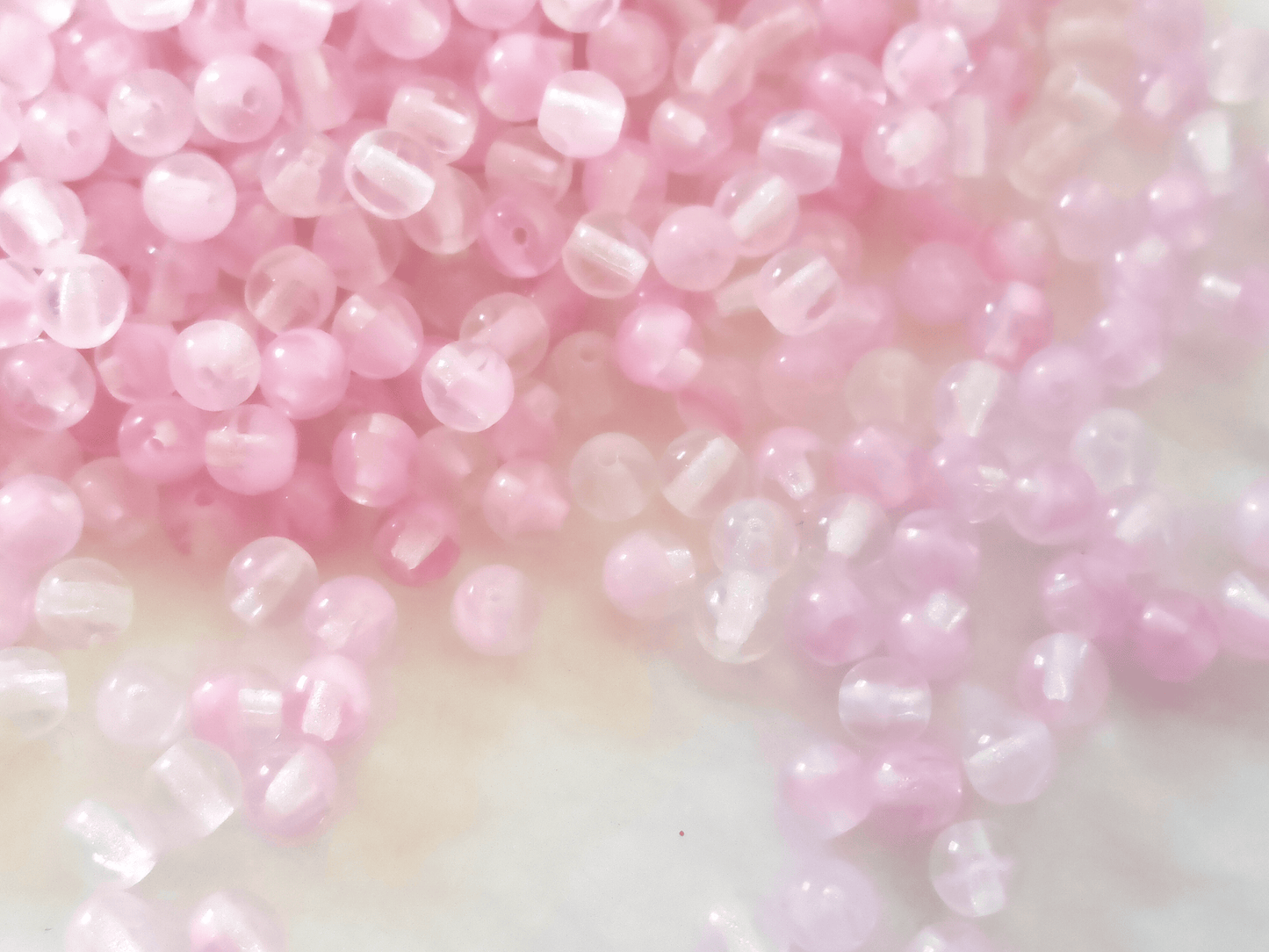 4mm round beads - colorless & light pink