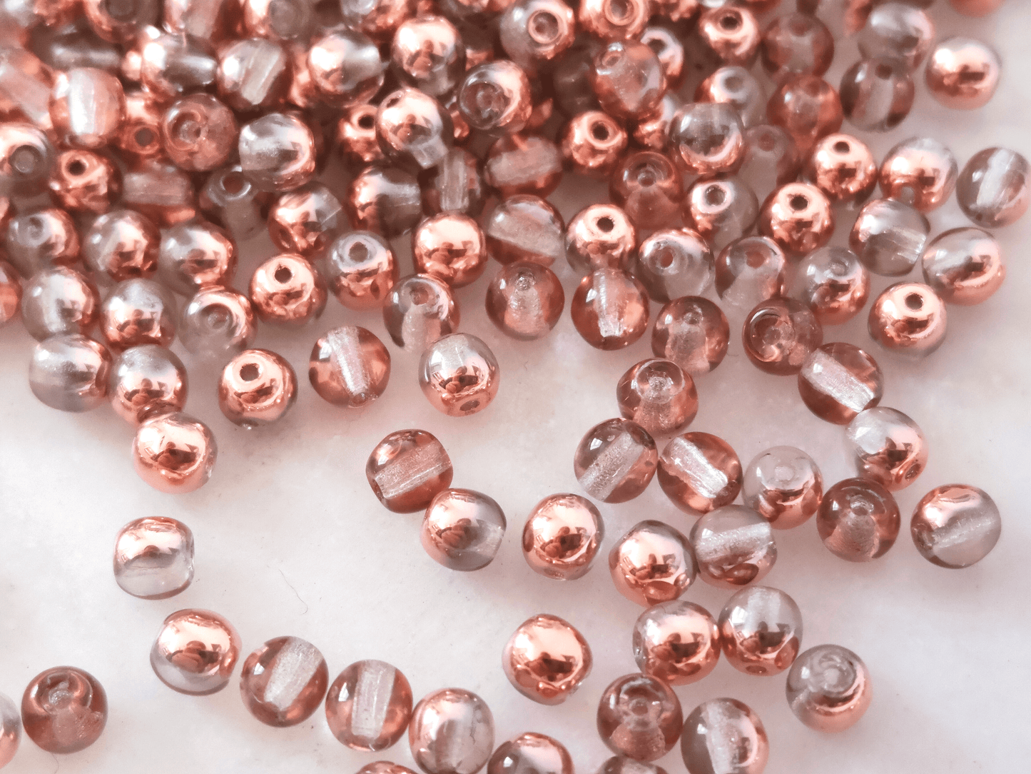 4mm round beads - colorless & copper