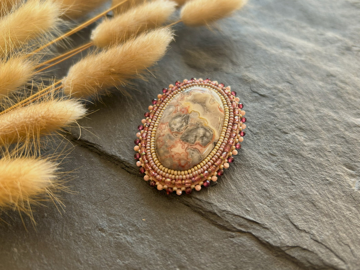 Agate brooch with rhodochrosite and garnet