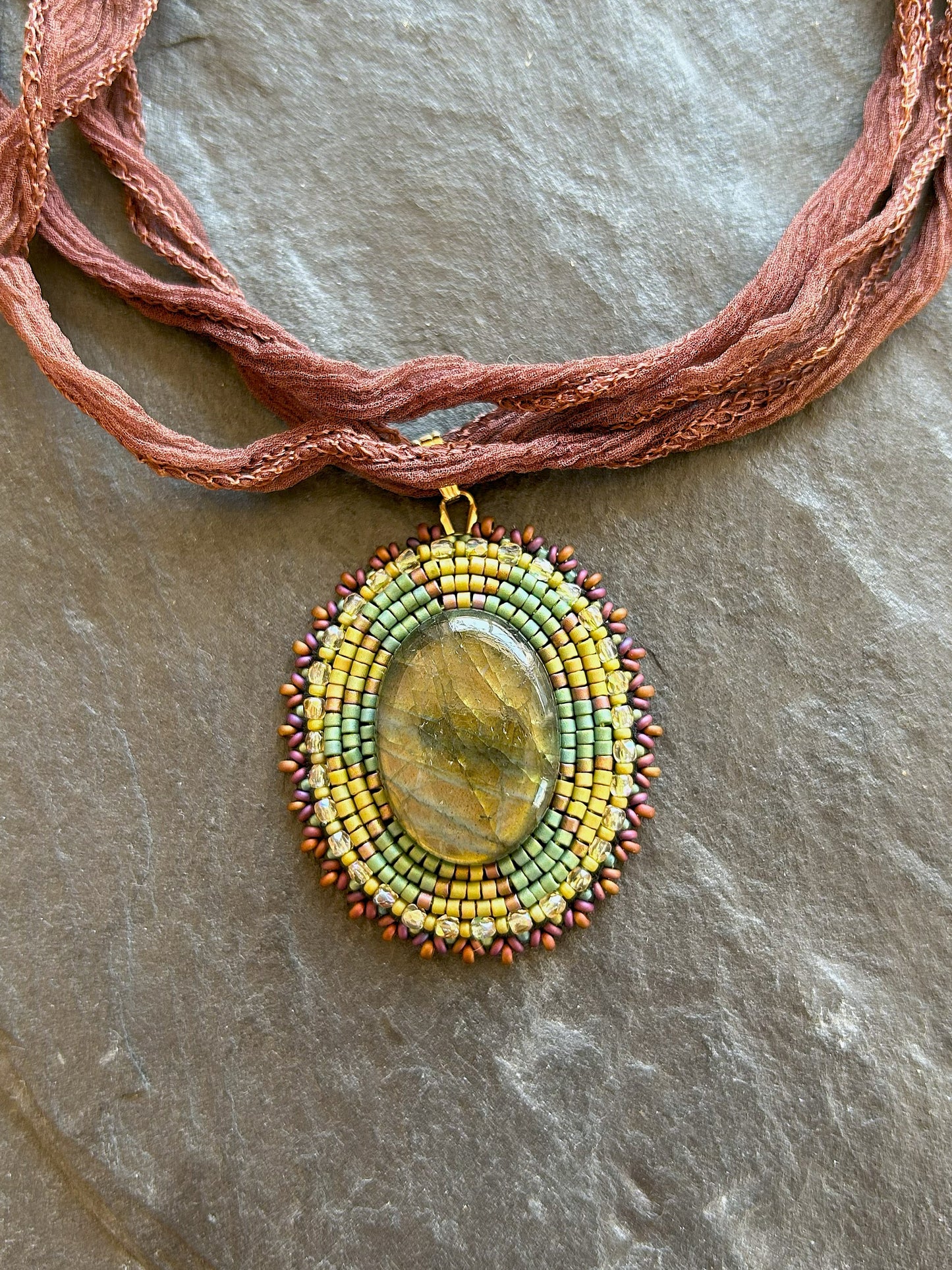 Iridescent labradorite necklace pendant with green fire