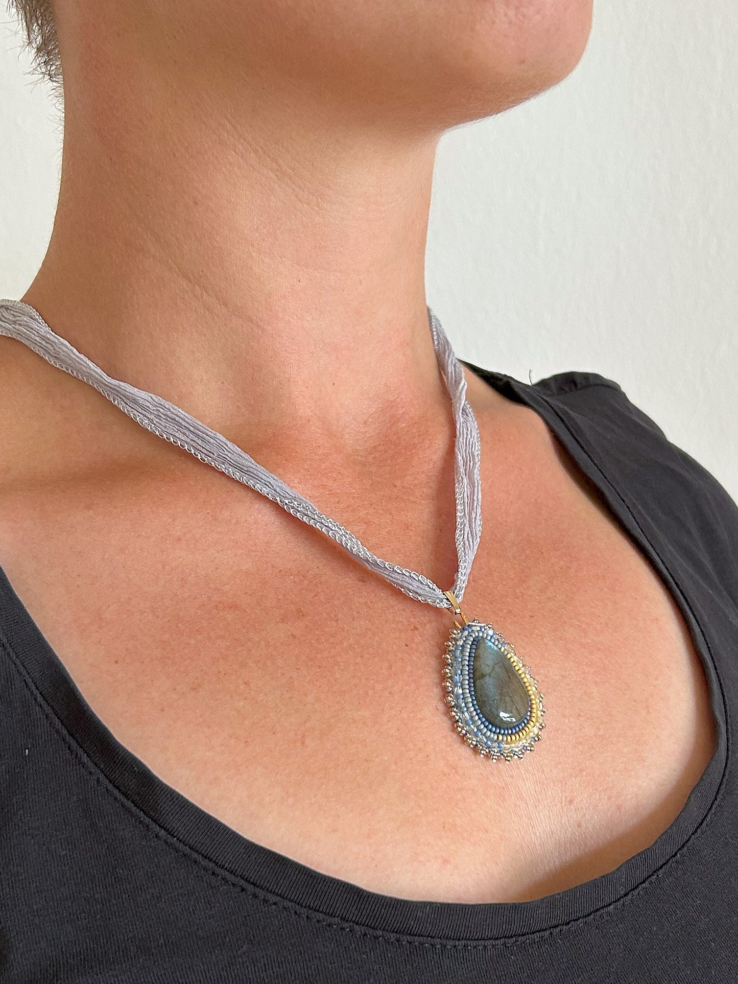 Small labradorite necklace pendant with blue to yellow fire