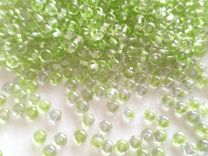 Faceted rondelle beads 3x5mm - light green & colorless