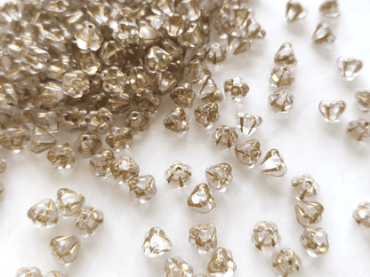 Bell flower beads 4x6mm - colorless & gold