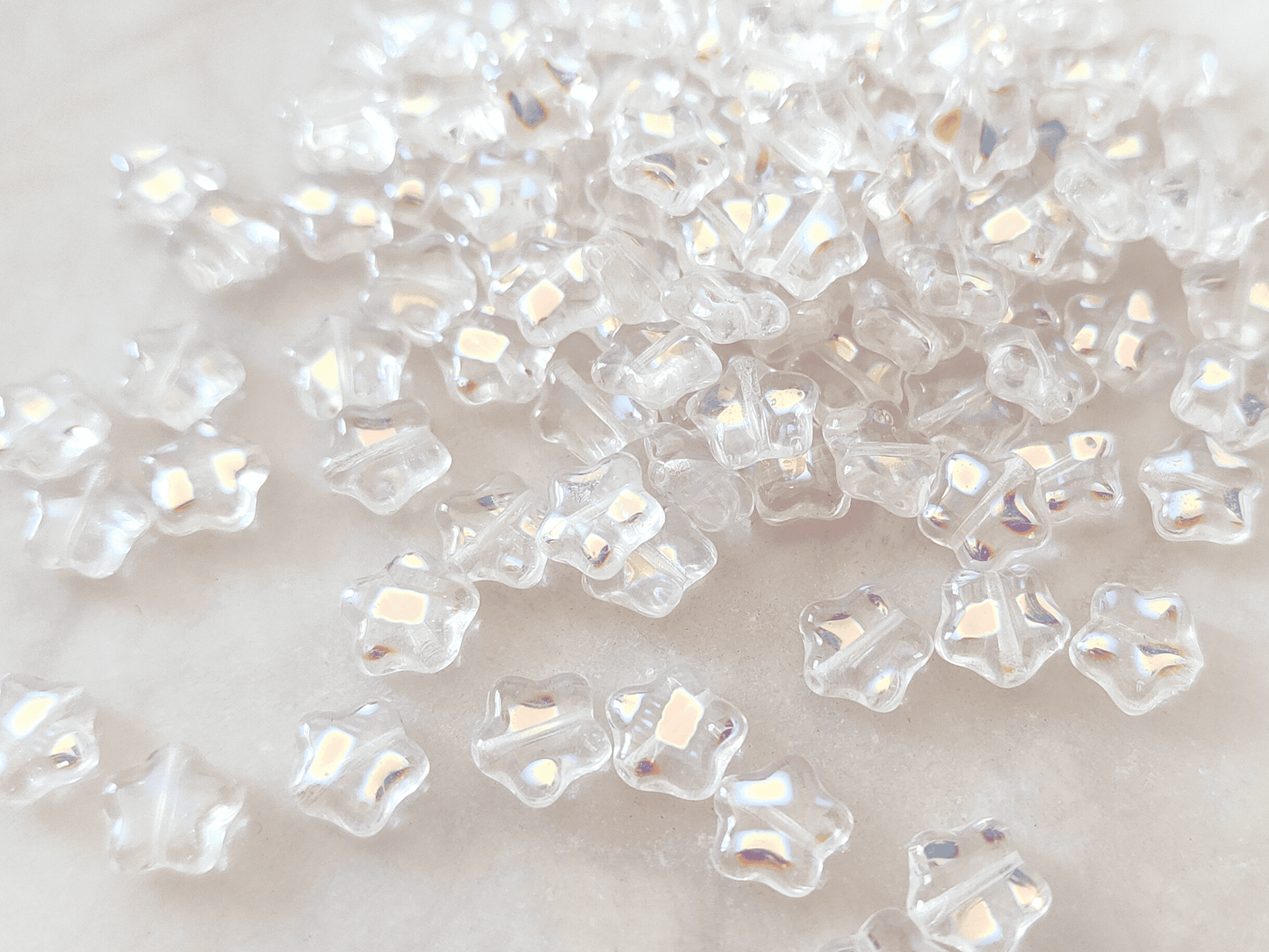 Star beads 8mm - colorless iris speckled