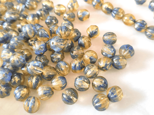 Melon beads 8mm - colorless, dark blue & gold glitter
