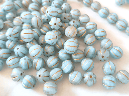 Melon beads 8mm - colorless, light blue & gold