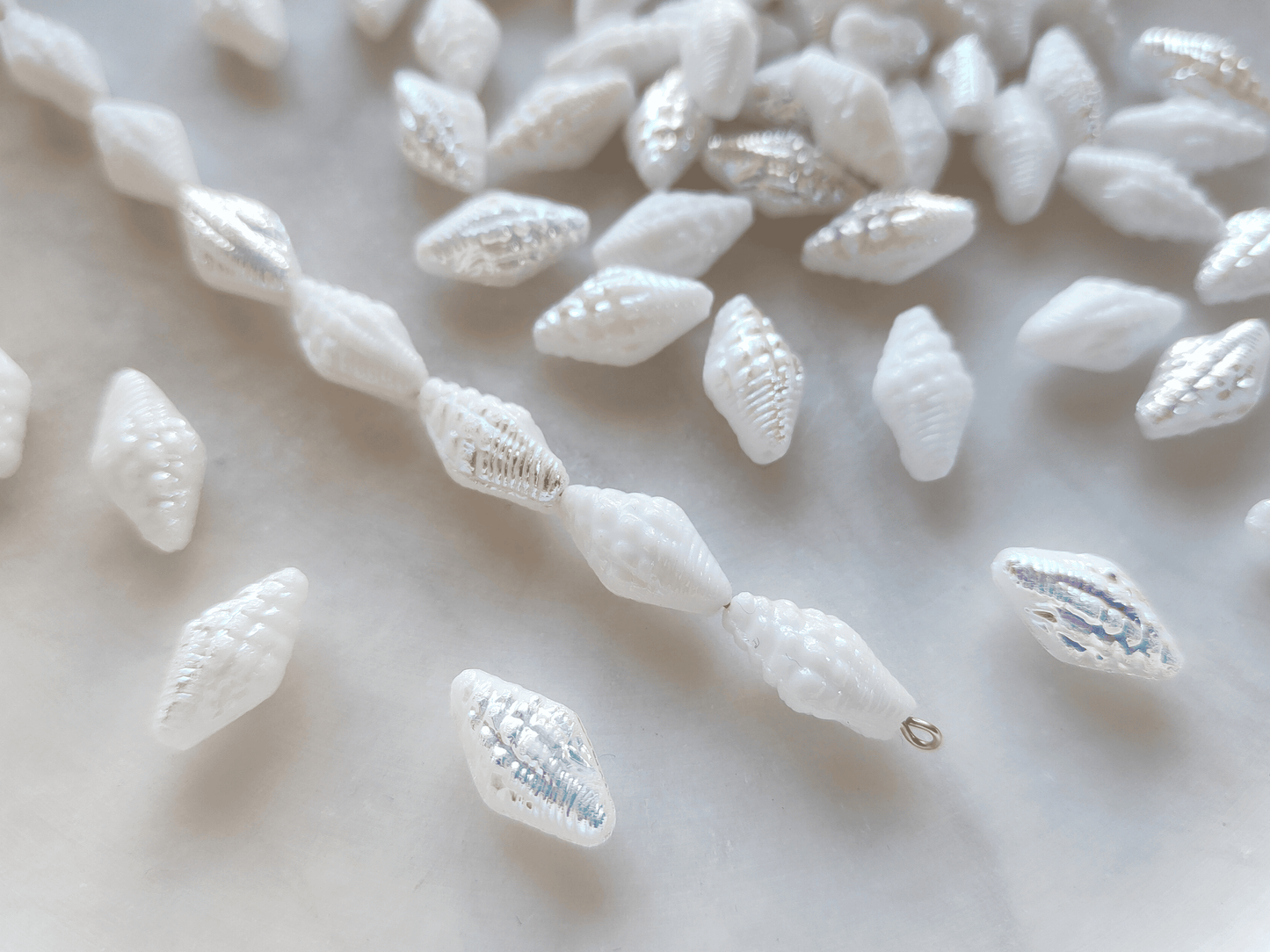 Miter shell beads 16x8mm - white iris