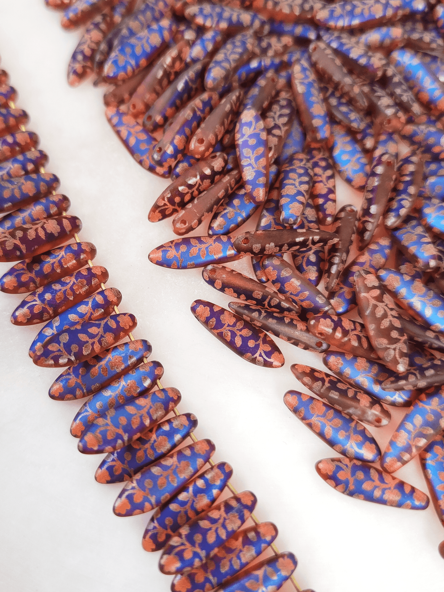 Dagger beads 5x16mm - red, blue & rose motif