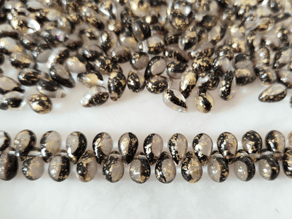 Drop beads 6x9mm - colorless, dark purple & golden speckles