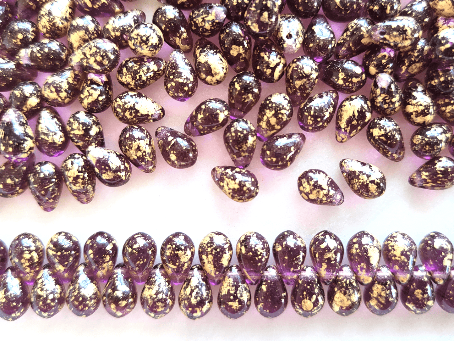 Drop beads 6x9mm - purple & golden speckles