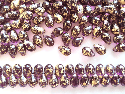 Drop beads 6x9mm - purple & golden speckles