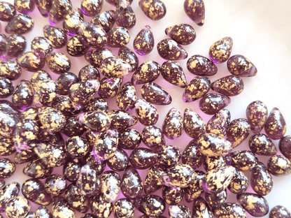 Drop beads 6x9mm - purple & golden speckles