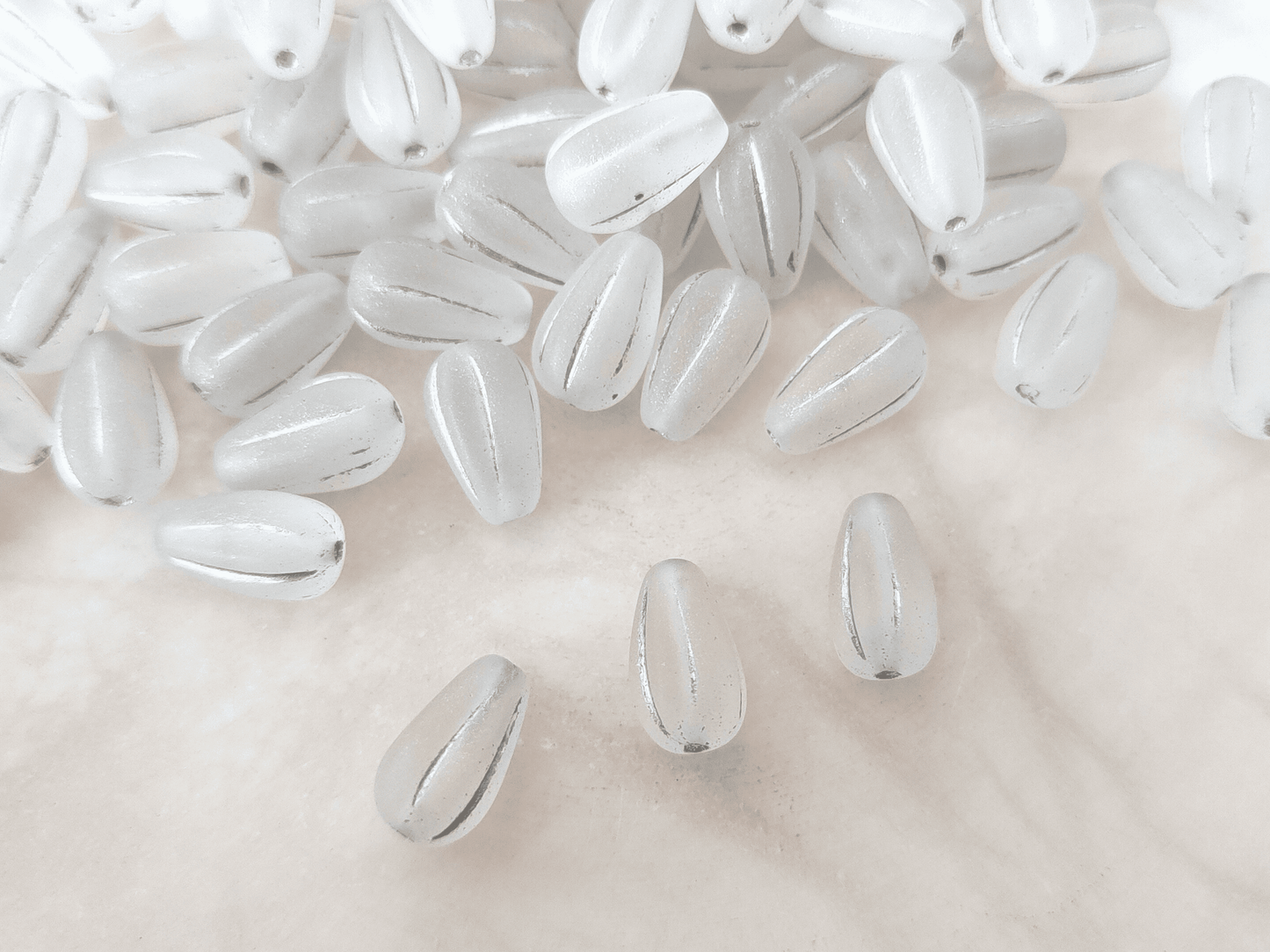 Melon drop beads 13x8mm - matt colorless & silver