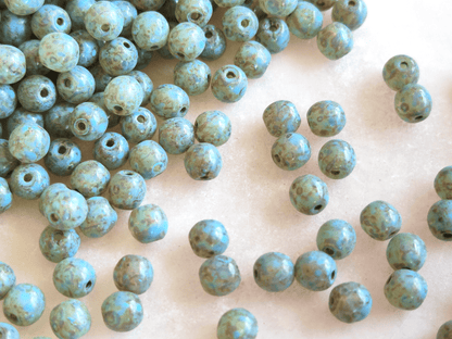 4mm round beads - light blue Picasso