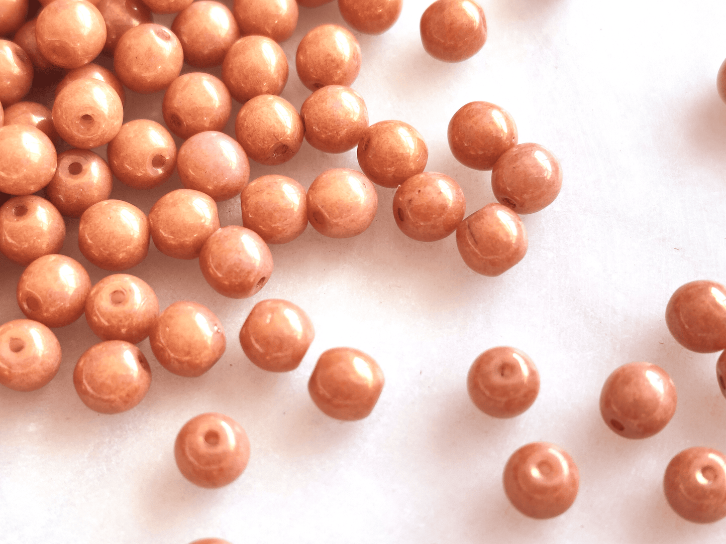 4mm round beads - shiny orange luster