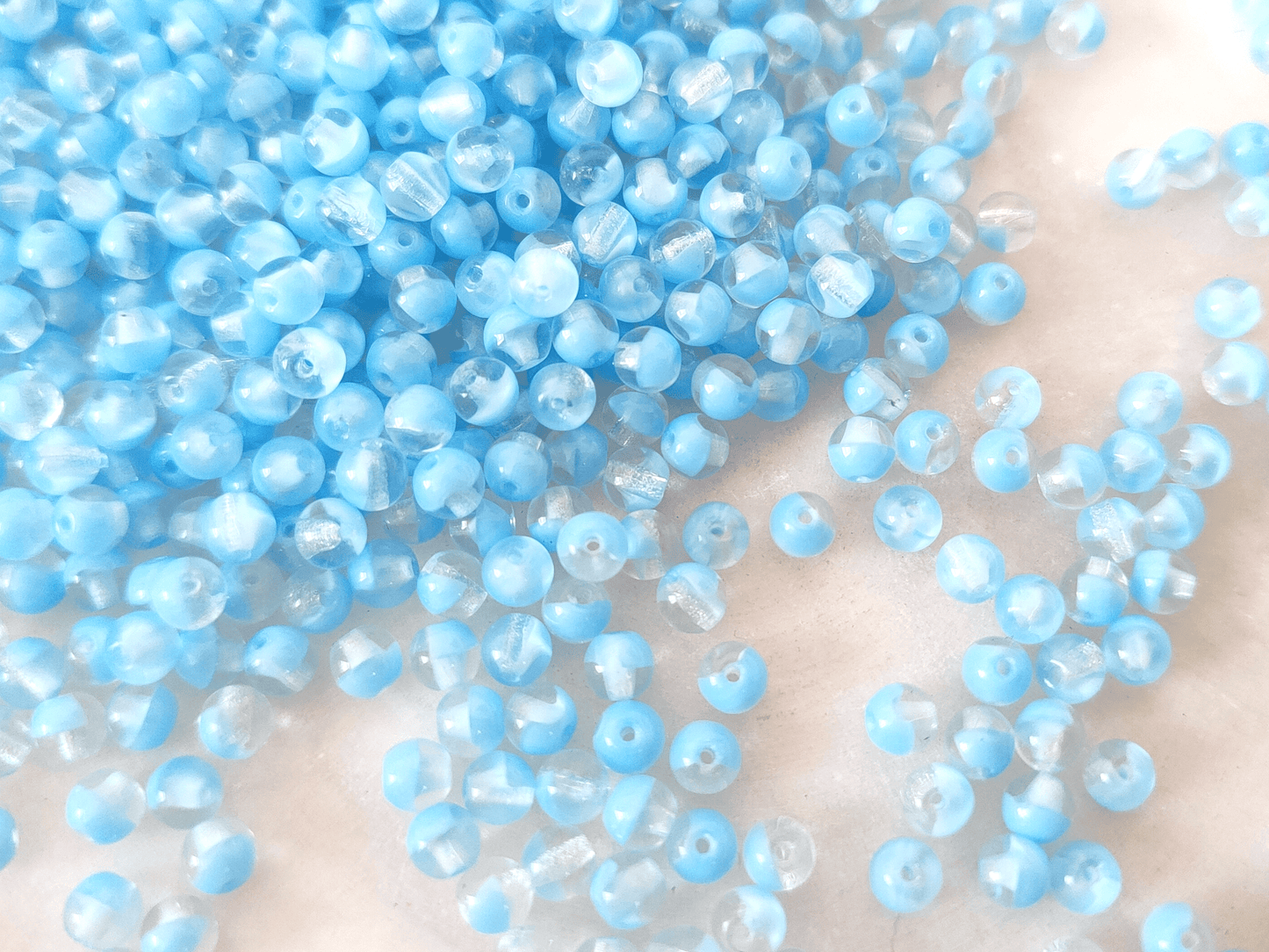 4mm round beads - colorless & sky blue