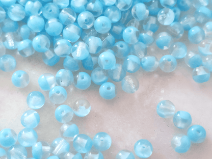 4mm round beads - colorless & sky blue